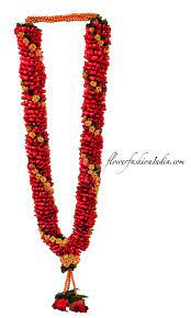 The Brilliance Of Roses In Wedding Garlands Flower Fashion India Red Rose Petals Rose Petals Wedding Indian Wedding Flowers