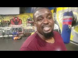 Trainer Darius Coit instructs amateur Hakeem Harmon