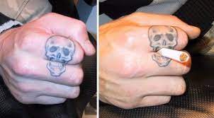 30 Creative Tattoos That Make Clever Use Of The Body Clever Tattoos Finger Tattoos Fade Skull Finger Tattoos