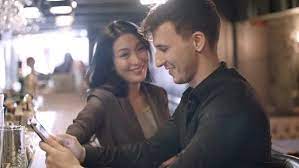 Asian Woman Chatting With Man At Bar Asian Woman Women Man
