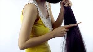 The part is the most defining aspect of the comb over style. Female Model Combing Her Beautiful Straight Hair Stock Video Knot9