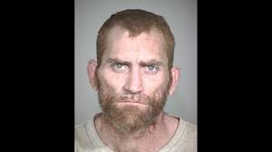 Officer's accused shooter pleads not guilty