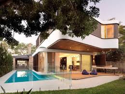 A Modern House With A Wraparound Swimming Pool Modern Pool House Modern House Design Pool House