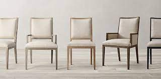 Restoration hardware reclaimed wood dining table and white fabric chairs brings a modern farmhouse appeal along with a black hutch and cabinet in a nook. Fabric Chair Collections Rh