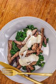 Warm Chopped Greens W Crispy Beef Tenderloin Strips Cheese Sauce Crispy Beef Steak Dishes Beef Tenderloin