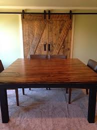 This Rustic Dining Room Is Made Complete With A Square Farmhouse Table Custom Bui Square Dining Room Table Farmhouse Dining Table Rustic Farmhouse Dining Table