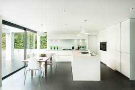 This modern kitchen employs clean lines, cuts, and forms to achieve a minimalist look few kitchens can pull off. Dark Gray Tile Floor Houzz
