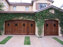 Carriage house collection garage doors combine distinctive carriage house designs and superior insulated steel construction to create a harmonious blend of elegance and strength. Pin On Spanish Garage Doors Gates