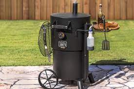 Its movable grate and additional meat hangers let you customize your setup your way. Smoke Meats Like The Pros Oklahoma Joe S Bronco Drum Smoker Review Gearjunkie