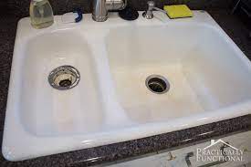 Mix equal parts water and distilled white vinegar in a spray bottle. How To Clean A Porcelain Sink Including The Stains And Scuff Marks Practically Functional