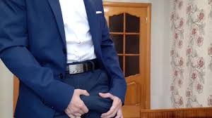 Russian guy in an office suit jerks off a cock