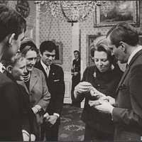 Photograph of President Gerald R. Ford, in his Pajamas, Meeting with Staff  Members Steve Todd (Military Aide) and Terry O'Donnell in the President's  Suite in the Akasaka Palace, Tokyo, Japan