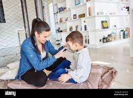 Mother teasing her son with index finger while playing at home in the  living room Stock Photo - Alamy