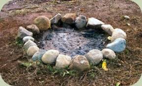 As coals develop in the main fire, they are scraped into the rectangular area, then used for cooking. Building A Fire Pit