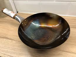 Clean pan using dishcloth or sponge: How To Choose Season Use A Carbon Steel Wok Kenny Mcgovern