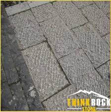 Concrete paver stones can blend into the surrounding environment or become a standout feature in landscape design. Outdoor Natural Bushhammered Chiselled Tumbled Limestone Pavers Cobblestone Cube Stone Factory China Wholesale Products Thinkrock Stone