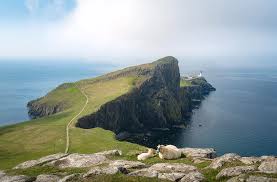 Download neist point lighthouse images and photos. Sheep In Front Of Neist Point Lighthouse Photograph By Roelof Nijholt