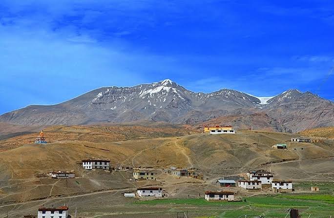 The giant Buddha statue overlooking Langza Village, known as the fossil village of Spiti Valley