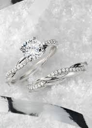 This Platinum Engagement Ring Features A Delicate Twist Of Pave Set Diamonds That Twist Diamond Engagement Rings Engagement Rings Twisted Wedding Rings Vintage