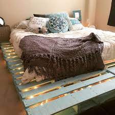 talk about mood lighting this is one of the easiest diy bed projects you can do some pallets a mat pallet bed frame diy pallet bed frames wood pallet beds