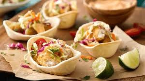 Radishes and cabbage are common garnishes on many mexican foods and add a nice, fresh crunch. Mini Fish Finger Tacos Recipe Mexican Recipes Old El Paso