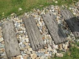 These Stepping Stones Look Like Old Wood But Are Concrete Garden Stepping Stones Garden Steps Stepping Stones Diy