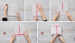 Give a flick of your wrist and use your other hand to straighten out the tissue paper. 3 Easy Genius Gift Wrapping Hacks