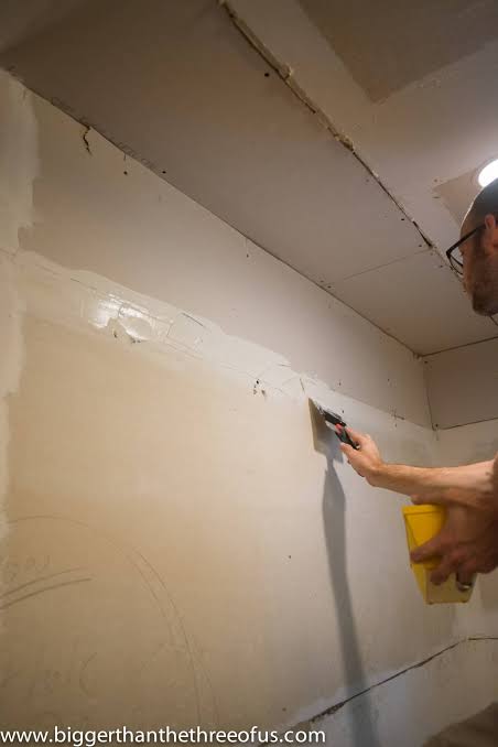 Peeling paint impacting drywall repair cost in Surrey before restoration