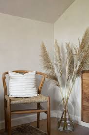 Home Decor Styling With Pampas Grass And Woven Chair Homedecor Pampasgrass Living Room Decor Set Cosy Dining Room Living Room Design Modern