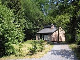 This stove is made from cast iron and requires gentle seasoning for the first few uses. Tidy Holiday Home With A Wood Burning Stove In A Green Area Izier