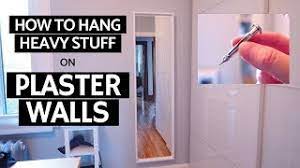 Clear out the bits of plaster hanging around the hole's opening. How To Hang Heavy Stuff On Plaster Walls Molly Bolts Youtube