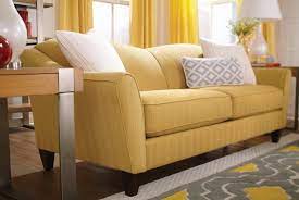 Furniture Lazyboy Sofas Yellow With White Pillows And A Wooden Table With Table Lamp And Flower Vase Comfortable Lazyboy Sofas