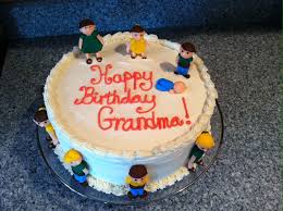 Birthday Cake For Grandma Chocolate Grandma Birthday Cake With Little Kids And Baby Molded From Molding Chocolates And Fondant The Cake Is V Vanilla Buttercream Icing Cake Grandma Birthday Cakes
