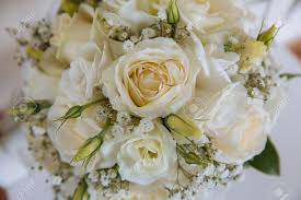 When someone so dear passes, a standing tribute is a fitting way to pay respects. Gold Rings On Wedding Bouquet Of Blue And White Fresh Flowers Stock Photo Picture And Royalty Free Image Image 65791267