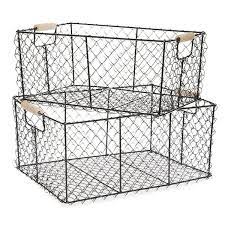 A wire bread basket or metal basket is ideal for upcycling into vintage farmhouse decor with burlap ribbon and galvanized spray paint! Two Farmhouse Baskets In 2021 Black Wire Basket Wire Basket Storage Wire Baskets