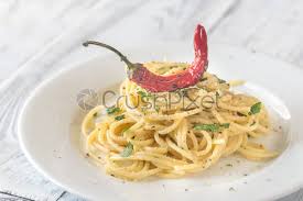 Pesto is most commonly interpreted as a mixture of crushed basil, garlic, cheese, nuts and olive oil, but this simple technique can be applied to so many other ingredients. Spaghetti Aglio Olio E Peperoncino Stock Photo Crushpixel