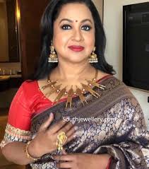 Karthikeyan of bigprint pictures and has music by yuvan shankar. Radhika Sarathkumar In Traditional Gold Jewellery