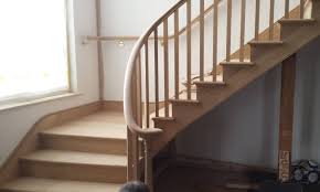 White painted treads tone with the interior scheme and have a classic edge profile whilst providing a contrast with the herringbone flooring.forged steel uprights are swaged and finished with hot wax. Staircases