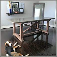 We made the cabinets, shelves and the countertops ourselves. Concrete Dining Table Diy For Less Uncookie Cutter