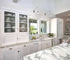white beach style kitchen with shiplap