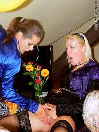 Several stocking wearing porn divas have a fully-clothed orgy