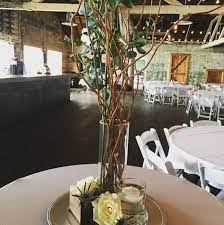 Branches Eucalyptus And White Roses Wedding Centerpiece Idea Sixteen03 Main Events Bisma Wedding Centerpieces Eucalyptus Centerpiece Reception Centerpieces
