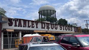 Sign for Stanley Drug Store in Charlotte unveiled during renovations