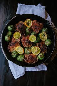 One Skillet Crispy Lemon Pepper Chicken Thighs And Whole Roasted Brussels Sprouts Recipe Lemon Pepper Chicken Roasted Brussel Sprouts Chicken Brussel Sprouts