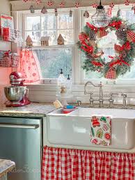 Christmas Decor In Farmhouse Style Kitchen With Vintage Sled Hanging Over The Island An In 2020 Christmas Kitchen Christmas Kitchen Decor Vintage Christmas Decorations