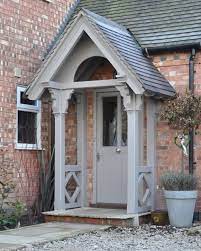 The open front porch below has a combination roof. Lovely Porch Area Credit The English Porch Company Porch Canopy Front Door Green Grey Country Countrys Cottage Front Doors Facade House Porch Design