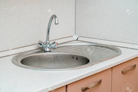 the photo of a white clean sink with