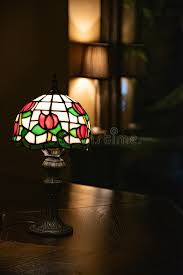 Pair of art deco 1930s uranium glass geometric floral lamp light shades vintage. Antique Table Lamp With Stained Glass Lampshade Closeup On Dark Blurry Background Glowing Mosaic Lamp With Floral Pattern Stock Photo Image Of Lamp Glare 173937662