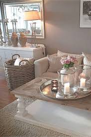 A casual color palette that includes a cream colored couch, blue and brown pillows , and a blue ottoman coffee table. Cozy Neutral Living Room Ideas Earthy Gray Living Rooms To Copy Clever Diy Ideas Deco Salon Cocooning Decoration Maison Deco Maison
