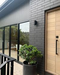 Are there exterior ideas for charcoal grey bungalow? R I V E R L A N D Projects On Instagram So Much Love For A Painted Charcoal Brick Renovation In 2021 House Paint Exterior Paint Brick Exterior Exterior Brick